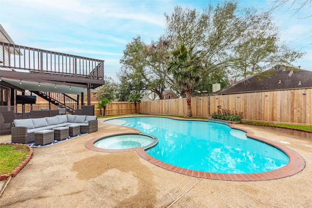 view of pool featuring outdoor lounge area, a patio, and an in ground hot tub