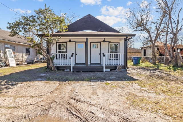 bungalow-style house featuring ceiling fan and a porch