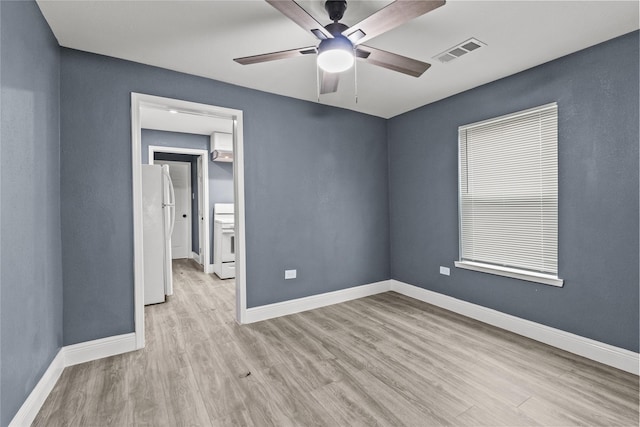 empty room with light hardwood / wood-style flooring and ceiling fan