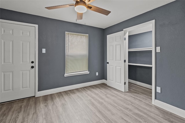 entryway with ceiling fan and light wood-type flooring