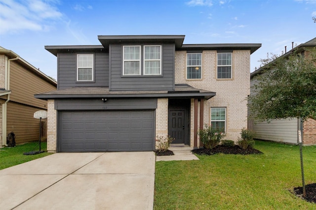 view of front property with a garage and a front lawn