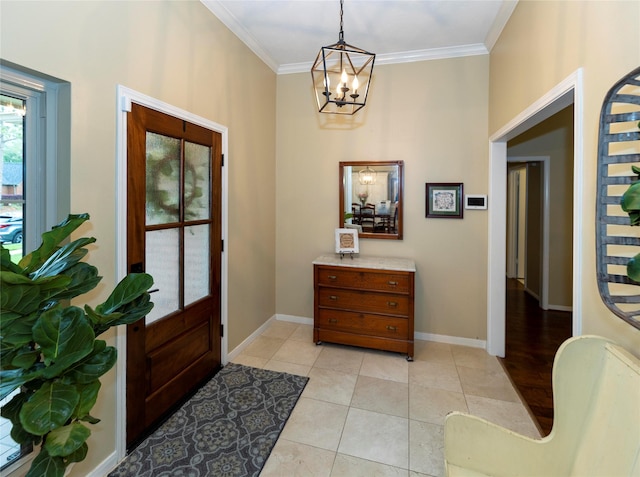 entryway with light tile patterned flooring, ornamental molding, and a notable chandelier