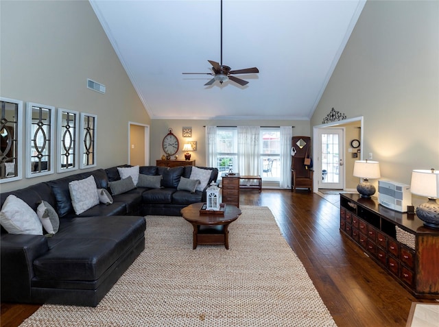 living room with hardwood / wood-style floors, ornamental molding, high vaulted ceiling, and ceiling fan