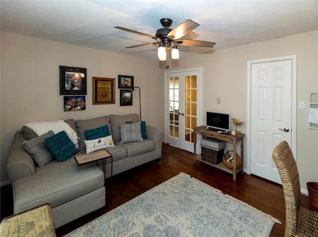 living room with dark hardwood / wood-style flooring, french doors, and ceiling fan