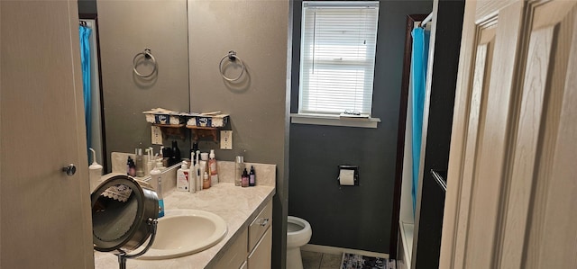 bathroom with vanity and toilet