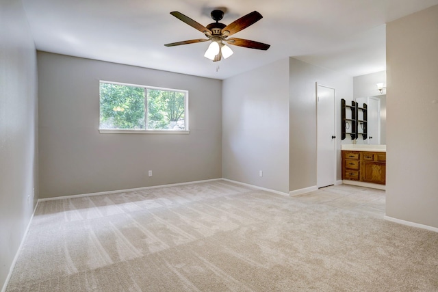 carpeted empty room with ceiling fan