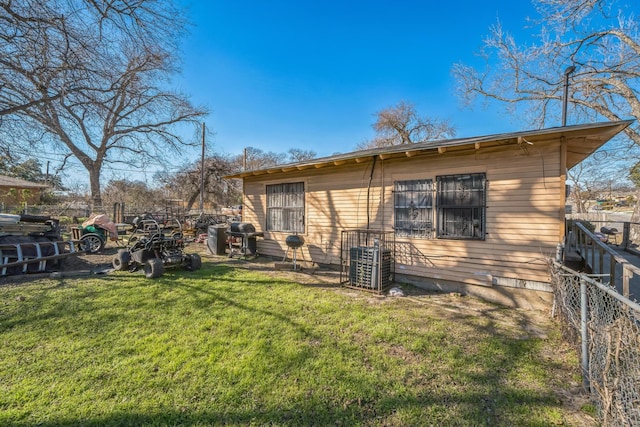 back of house with a yard