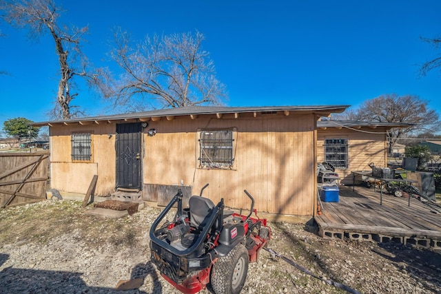 back of house featuring a deck