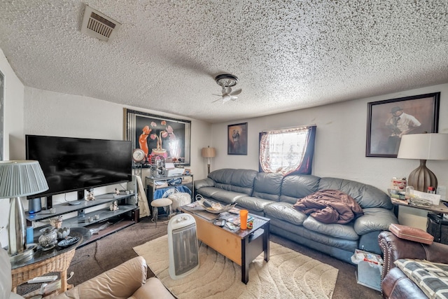 carpeted living room with a textured ceiling