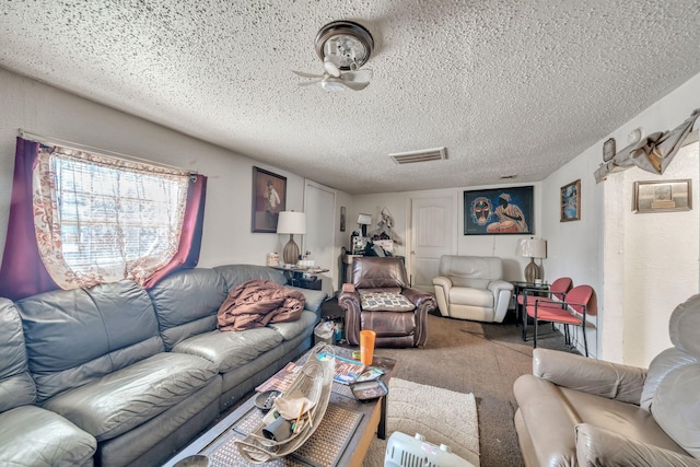 carpeted living room with a textured ceiling