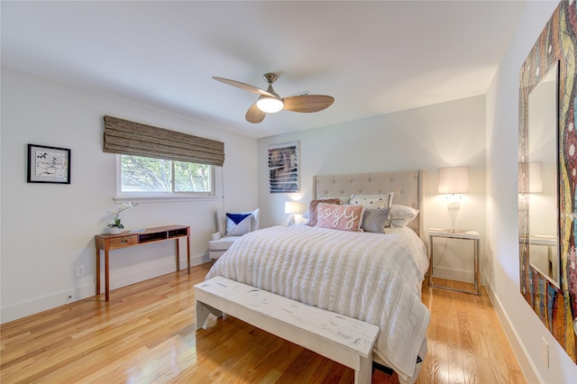 bedroom with ceiling fan and light hardwood / wood-style floors