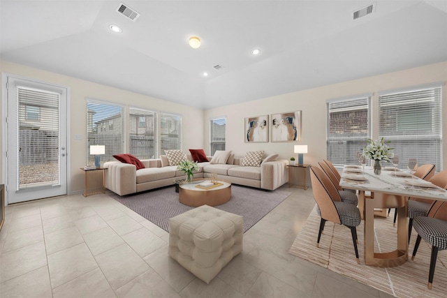 living room featuring vaulted ceiling