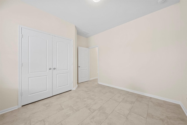 unfurnished bedroom with a closet