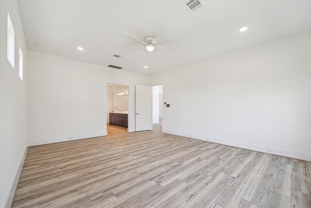 empty room featuring ceiling fan and light wood-type flooring