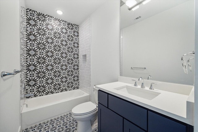 bathroom featuring visible vents, toilet, vanity, and bathtub / shower combination