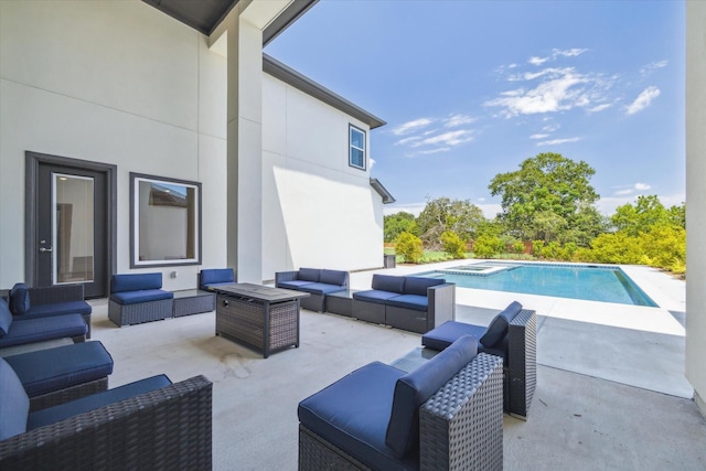 view of swimming pool featuring an outdoor living space and a patio area