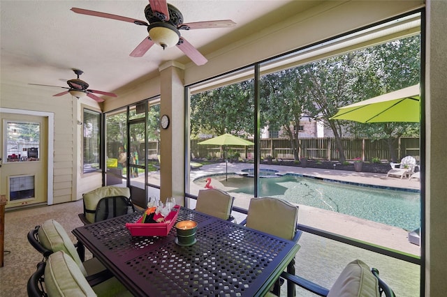 sunroom / solarium with ceiling fan