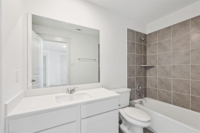 full bathroom with vanity, toilet, and tiled shower / bath