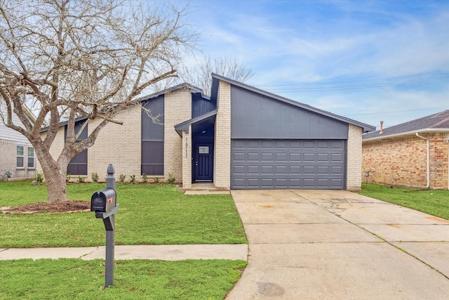 view of front of home featuring a garage and a front yard