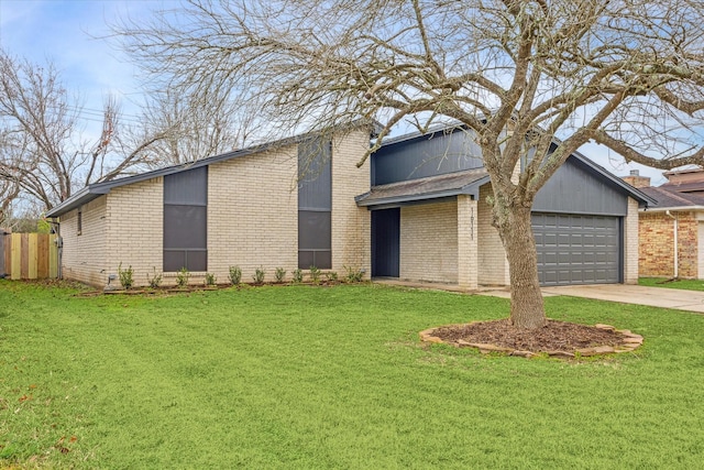 view of front of home with a garage and a front yard