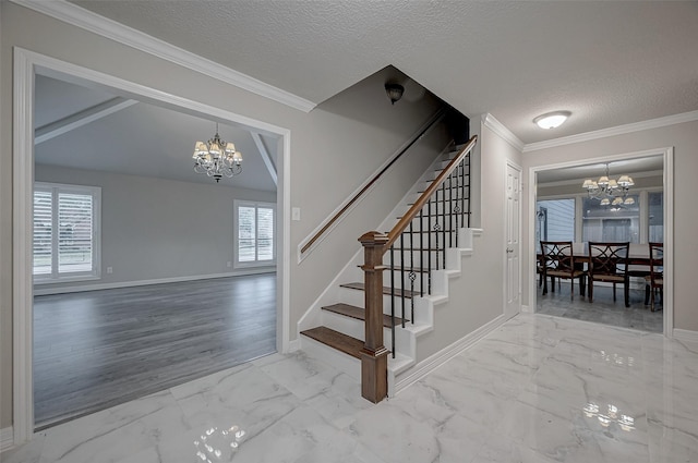 staircase featuring a notable chandelier, ornamental molding, and a textured ceiling