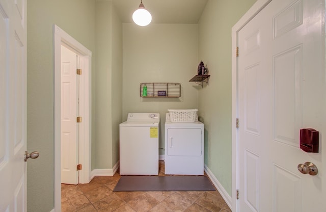 washroom featuring washing machine and dryer