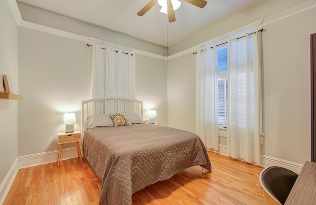 bedroom with ceiling fan and light hardwood / wood-style flooring