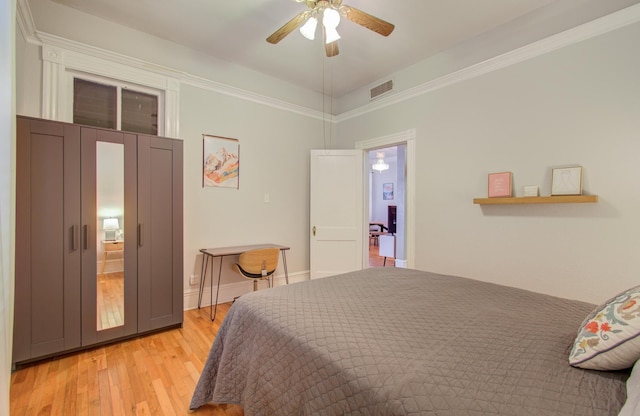 bedroom with ceiling fan and light hardwood / wood-style floors