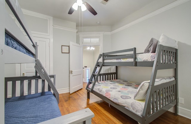 bedroom featuring wood-type flooring and ceiling fan