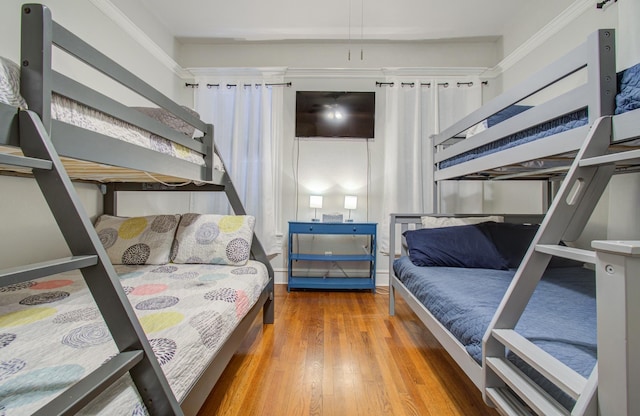 bedroom with hardwood / wood-style flooring