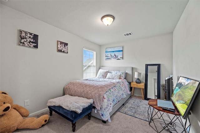 bedroom featuring light colored carpet