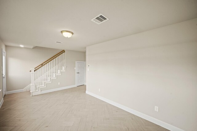 5613 Iris Harvest Ln, Houston, TX 77091 - spare room featuring baseboards and stairway