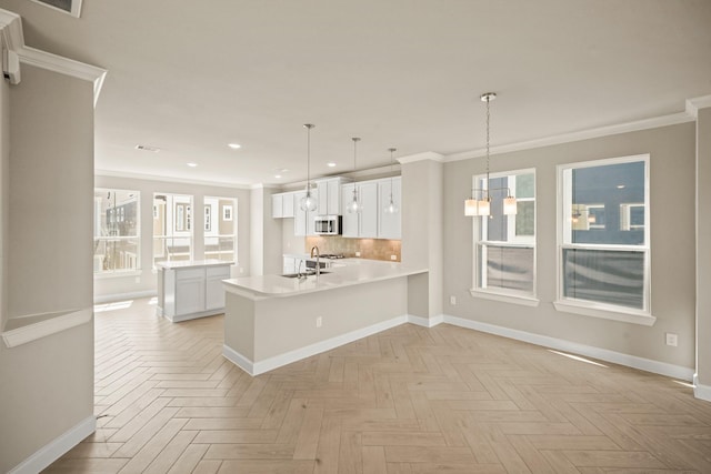 5613 Iris Harvest Ln, Houston, TX 77091 - kitchen with recessed lighting, baseboards, crown molding, light countertops, and a sink