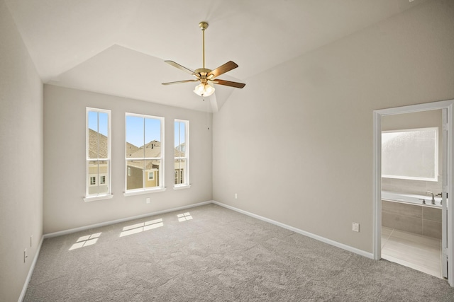 5613 Iris Harvest Ln, Houston, TX 77091 - unfurnished bedroom with carpet flooring, lofted ceiling, baseboards, ensuite bath, and ceiling fan