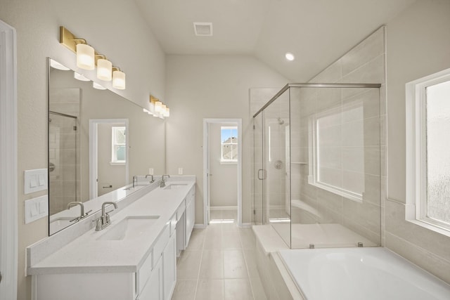 5613 Iris Harvest Ln, Houston, TX 77091 - full bathroom featuring a stall shower, lofted ceiling, tile patterned floors, double vanity, and a tub