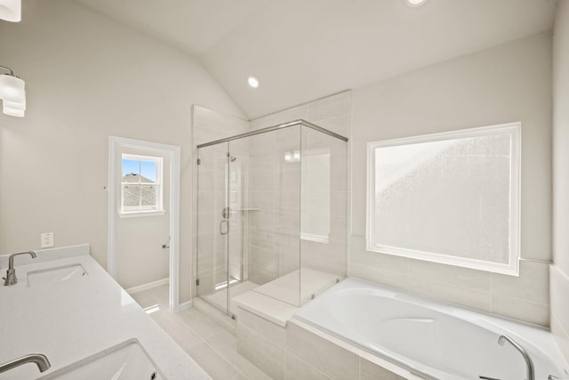 5613 Iris Harvest Ln, Houston, TX 77091 - bathroom with a stall shower, a garden tub, lofted ceiling, tile patterned floors, and recessed lighting