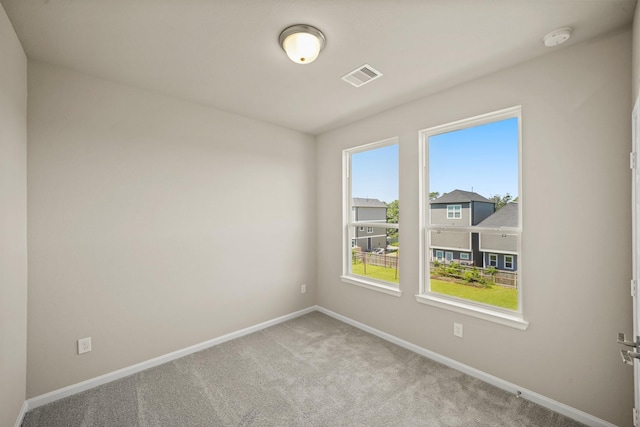 5613 Iris Harvest Ln, Houston, TX 77091 - unfurnished room featuring baseboards, carpet flooring, and a smoke detector