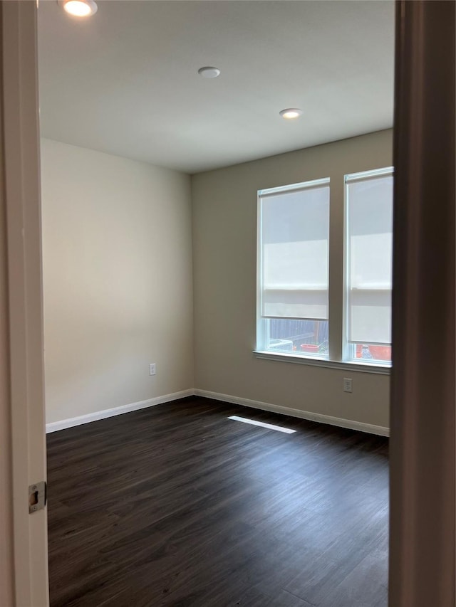 empty room featuring dark hardwood / wood-style floors