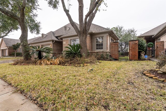 view of front of home with a front yard