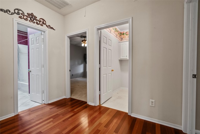 hallway with light wood-type flooring