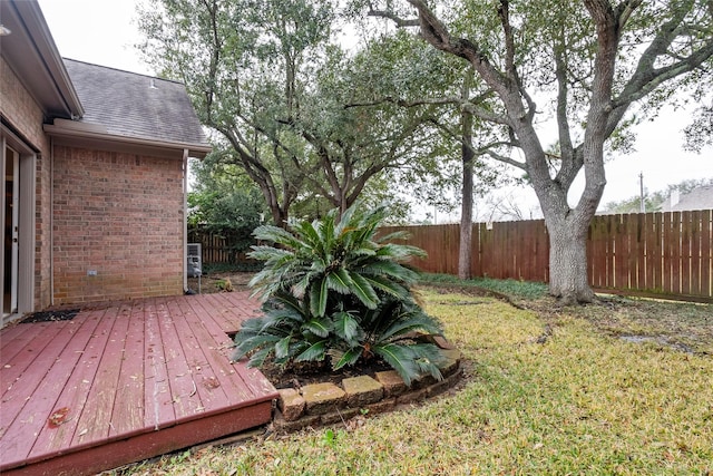 view of yard with a wooden deck