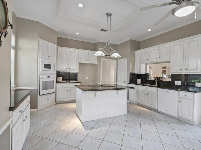 kitchen featuring light tile patterned floors, white appliances, visible vents, white cabinets, and a tray ceiling