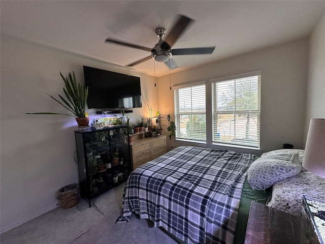 carpeted bedroom featuring a ceiling fan