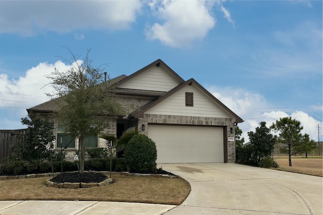 view of front facade featuring a garage, brick siding, and driveway