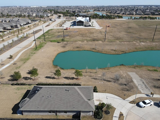 aerial view featuring a water view and a residential view