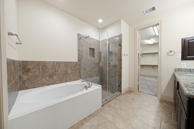 bathroom featuring vanity and plus walk in shower