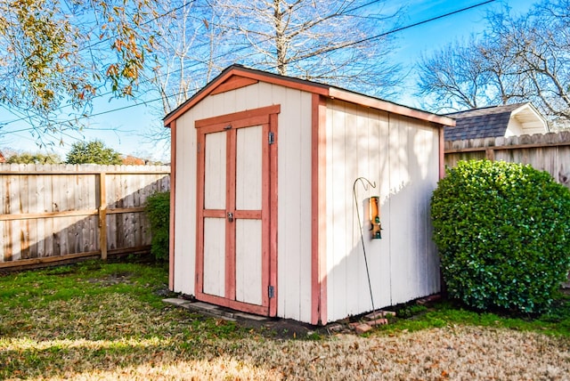 view of shed with fence