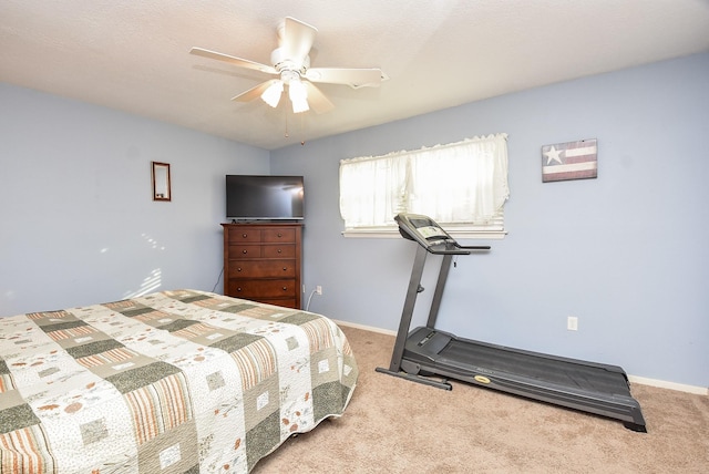 bedroom featuring a ceiling fan, baseboards, and carpet flooring