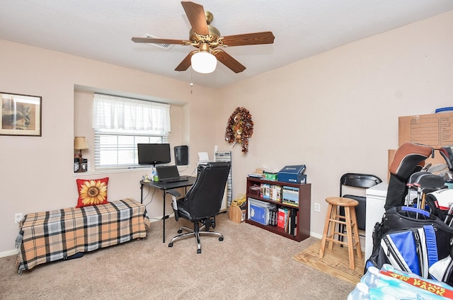 office featuring carpet flooring, ceiling fan, and baseboards