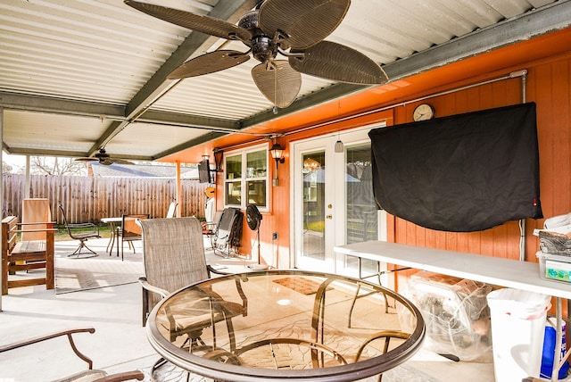 view of patio / terrace featuring outdoor dining area, fence, and ceiling fan